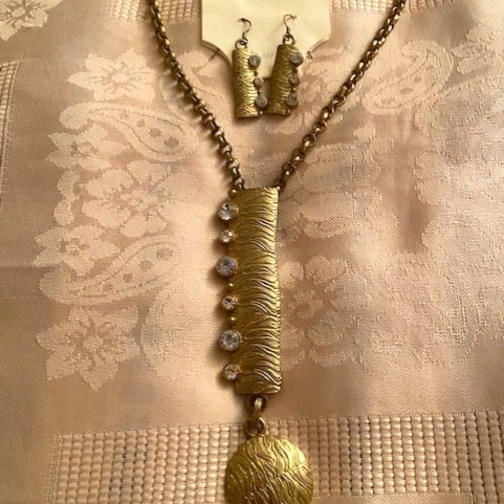 Goldtone Necklace and Earings are  in the original packaging